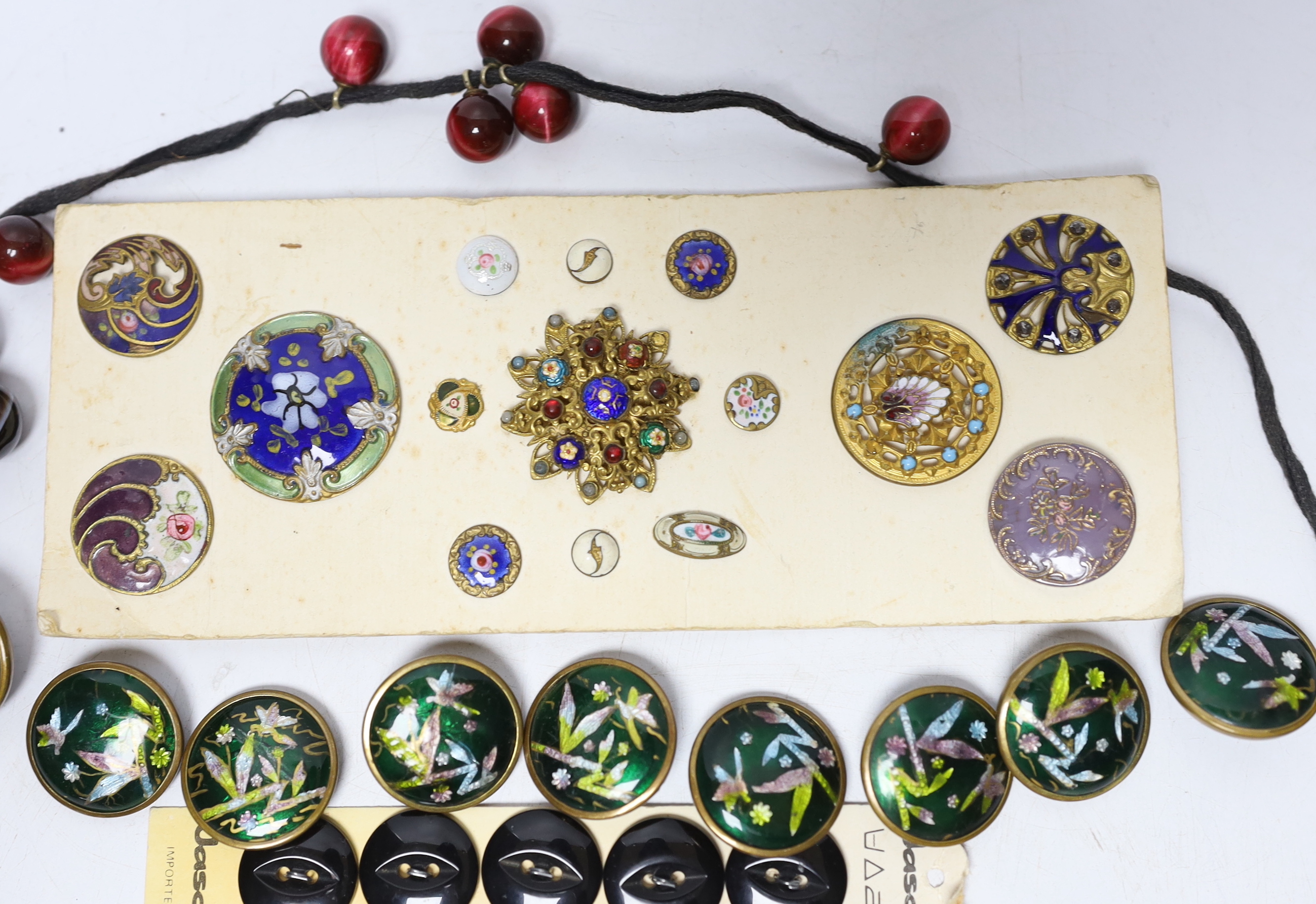 A quantity of enamel buttons, etc.